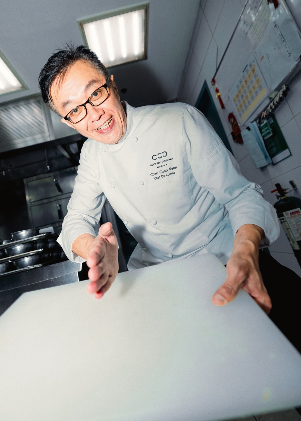 Chef Chan standing behind a chopping board