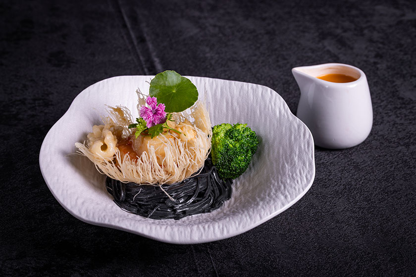 Braised assorted seafood in golden nest with homemade charcoal noodle