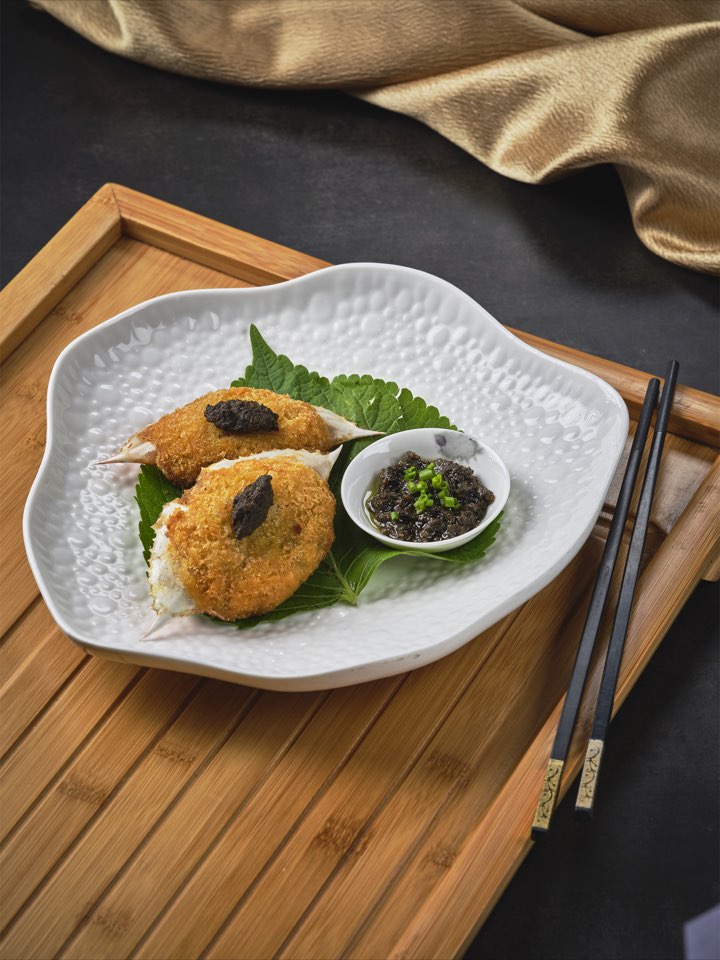 Baked crab shells stuffed with mushroom and black truffle