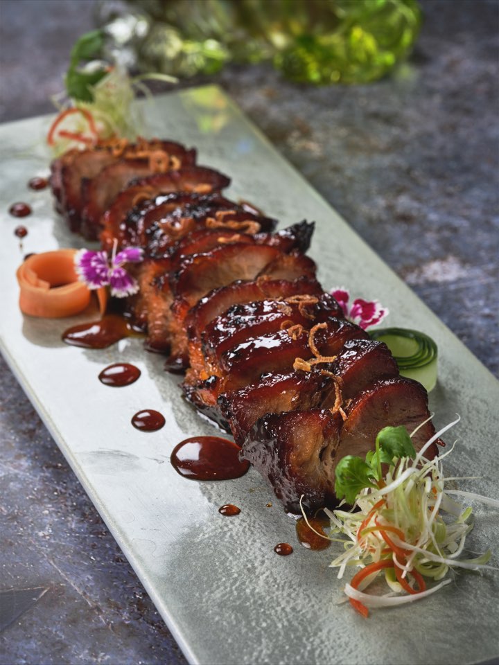 Glazed barbecue honey pork sliced on a serving platter