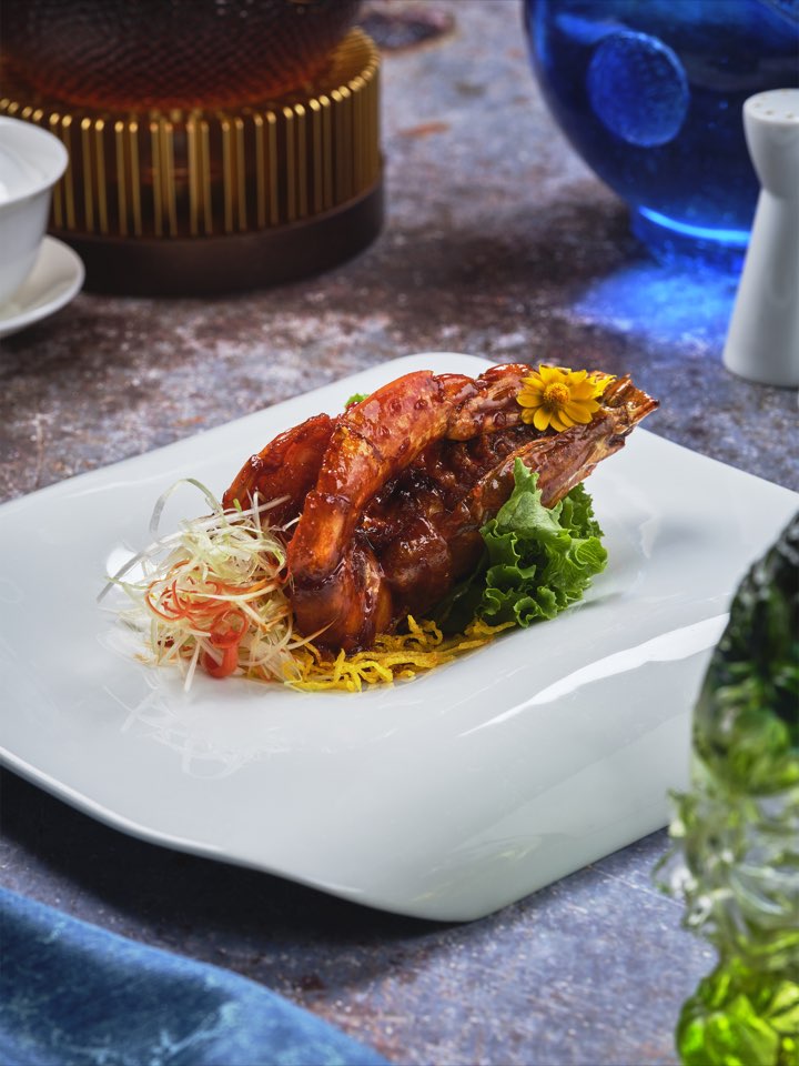Crispy roasted chicken presented on a white platter